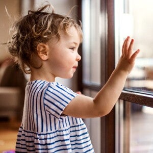 toddler looking out the window