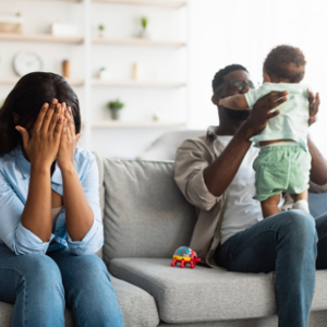 mother upset on the lounge with father and son next to her