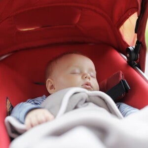 Baby sleeping in a pram