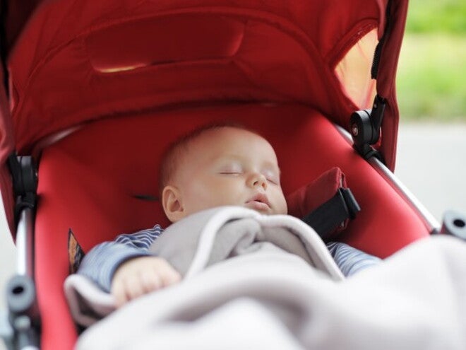 Baby sleeping in a pram