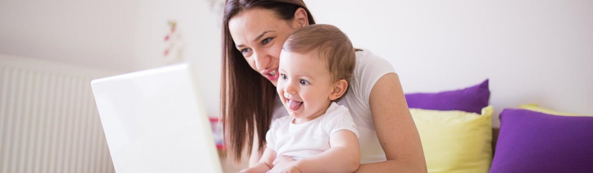mother and child looking at a computer